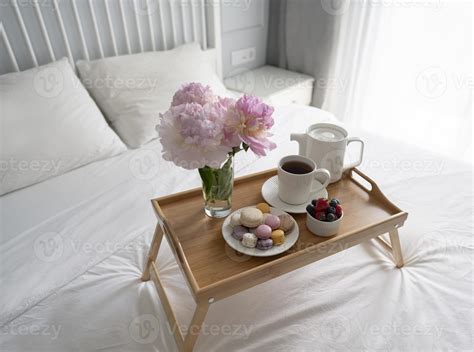 Tray with breakfast on bed. 8726078 Stock Photo at Vecteezy