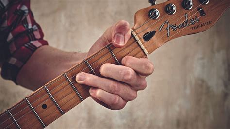 how to play tab music on guitar