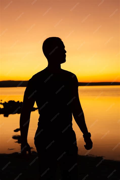 Premium Photo | Silhouette of a man at sunset