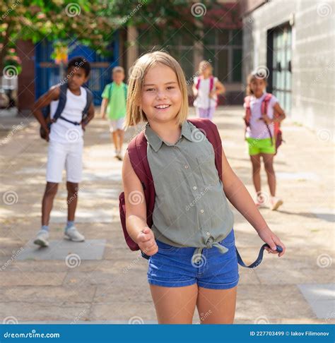 Cheerful Preteen Girl with Backpack Going To School on Summer Day Stock