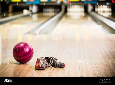 Bowling shoes and ball Stock Photo - Alamy