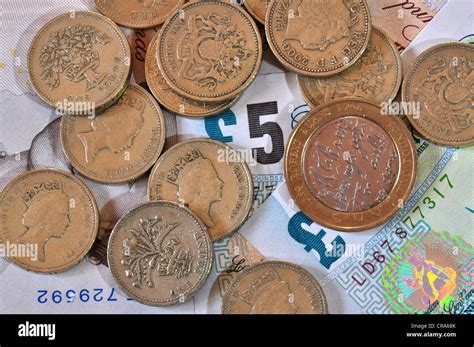 pound notes  pound coins uk stock photo alamy