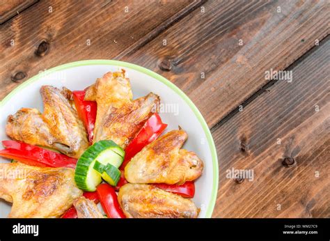 Chicken wings baked with vegetable and garlic Stock Photo - Alamy