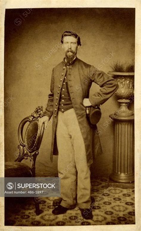 Portrait of man wearing Civil War Uniform - SuperStock