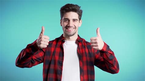 young man smiling  thumbs  image  stock photo public