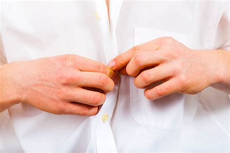 buttoning buttons stock  pictures royalty  images istock