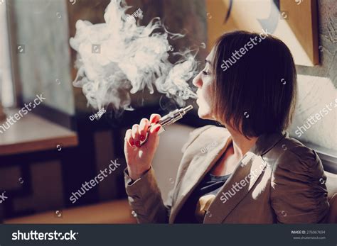 9,323 Woman smoking e cigarette Images, Stock Photos & Vectors | Shutterstock