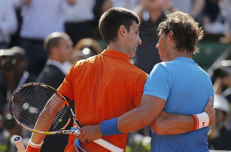 Novak Djokovic of Serbia shakes hands with Rafael Nadal of Spain after ...