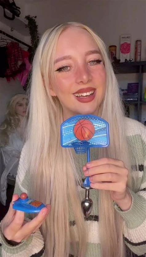 OnlyFans star confuses fans playing with mini basketball hoop attached