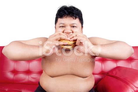 Hungry Person Eating Burger Stock Photo | Royalty-Free | FreeImages