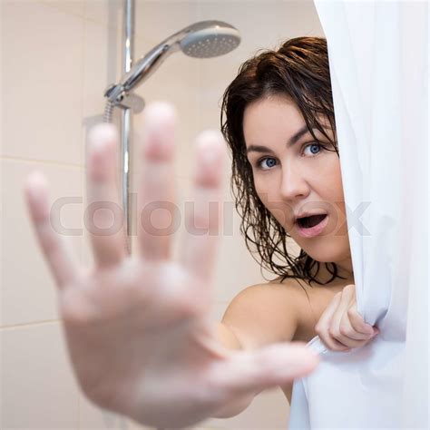 pretty woman hiding  shower curtain stock image colourbox