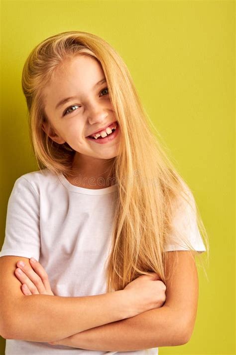 portrait  long haired happy kid girl isolated  green background