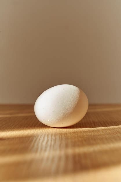 premium photo fresh organic white egg   wooden kitchen counter