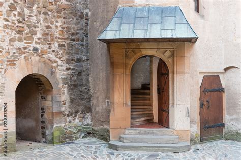 Old wall and the side door in the medieval castle in Bouzov. Stone ...