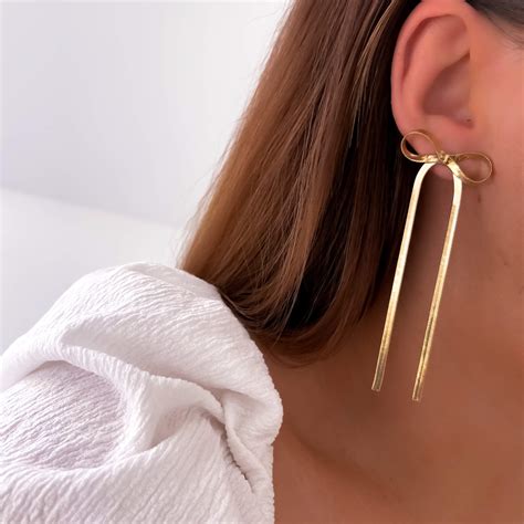 kolczyki złote stal chirurgiczna kokardki wiszące- największy wybór