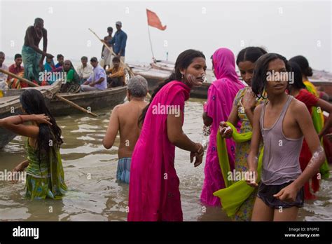 Bathing in holy Ganges river, Varanasi, India Stock Photo - Alamy