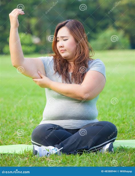 Young Woman Checking Her Arm Fat Stock Photo - Image of adult, measure