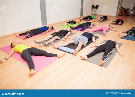 Group Of People Lying Down In Yoga Class Stock Photo - Image of indoor ...