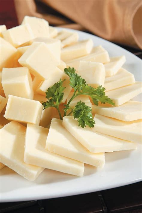 Cheese Platter with Garnish on White Plate - Prepared Food Photos, Inc.