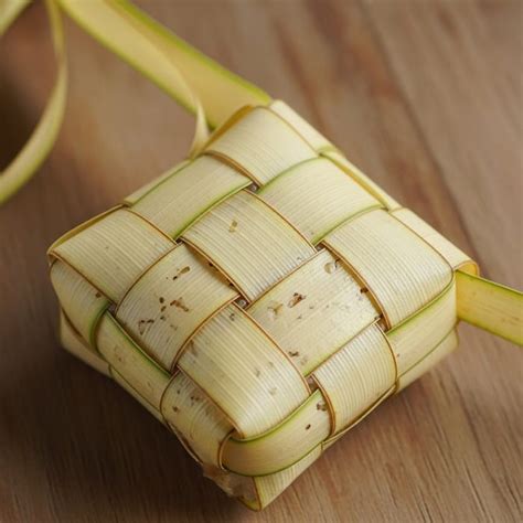 ketupat diamond shaped rice filled palm leaf pouch ai art generator