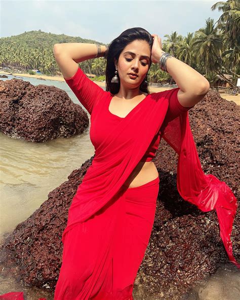tv host  actress sreemukhi red saree photoshoot  beach