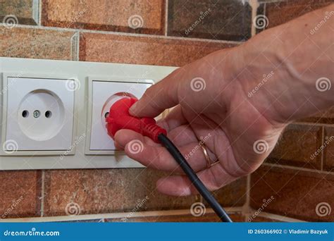 plugging plug   outletmale hands pull   plug