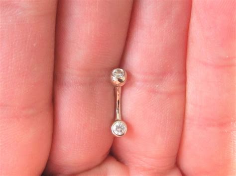 white gold genitalclithoodchristinabelly piercing double clear
