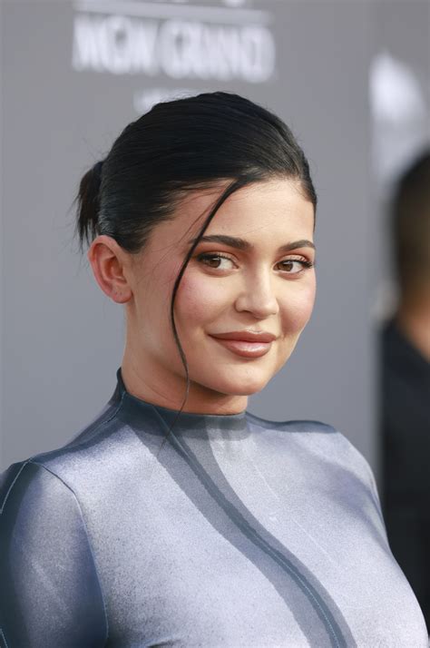 Kylie Jenner shocks fans by appearing to ‘ANNOUNCE PREGNANCY’ as she