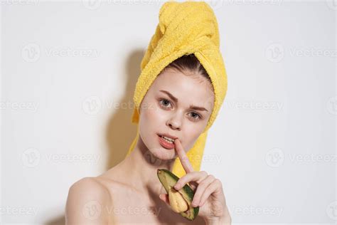 Pretty woman naked shoulders avocado exotic fruits cosmetics clean skin