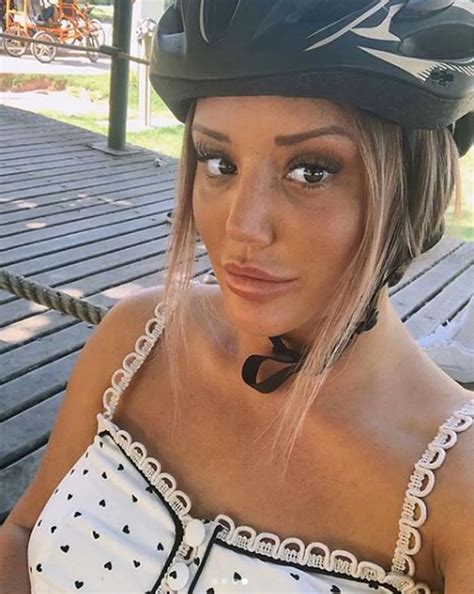 Braless Charlotte Crosby nearly falls out of her top on romantic bike