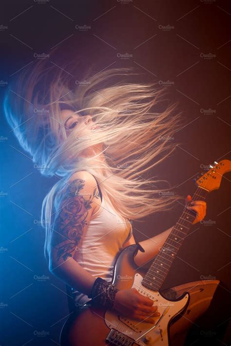 Woman playing electric guitar stock photo containing concert and ...