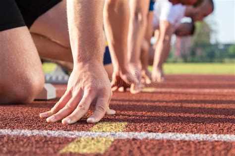 Athletes at the Sprint Start Line in Track and Field Stock Photo ...