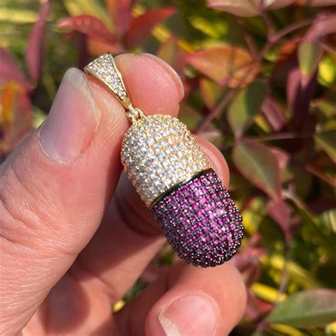 gold capsule pendant