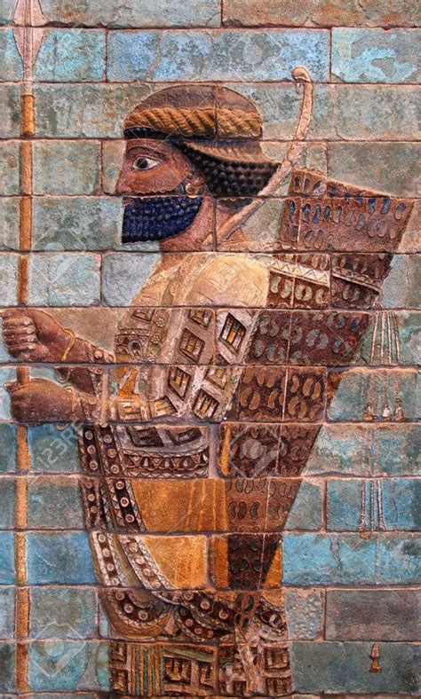 an ancient painting on the side of a brick wall with a man holding a staff
