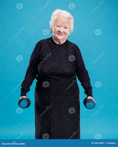 Happy Old Woman Making Fitness Training with Dumbbells Stock Image