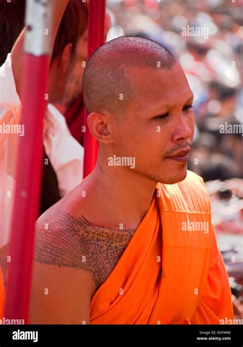 monk with tattoos at the Wat Bang Phra Tattoo Festival in Thailand ...