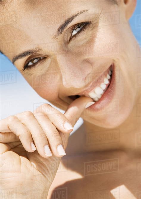 woman biting thumb close  stock photo dissolve