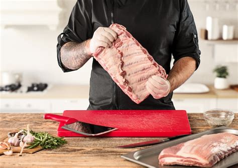 Free Photo | Man cooking meat steak on kitchen