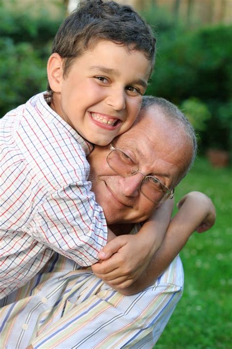 happy grandfather father  son grandpa teaching grangson  home