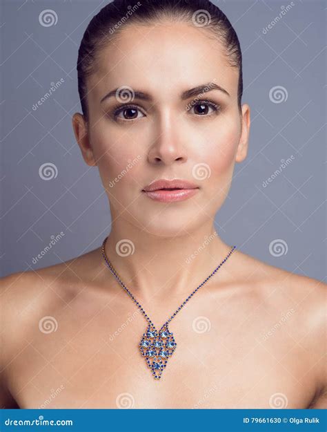 Portrait of Young Beautiful Dark-haired Model with Nude Make-up and