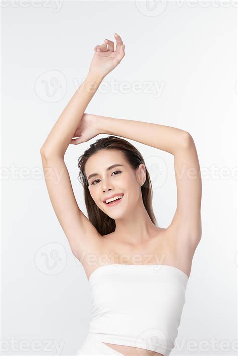 Beautiful Young Asian woman lifting hands up to show off clean and