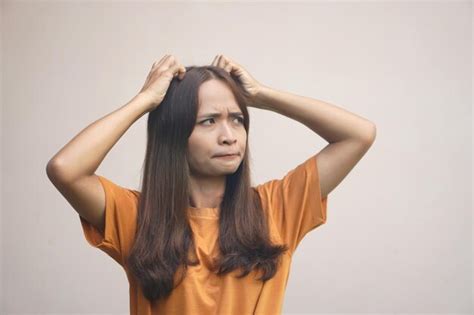 premium photo asian woman  itchy head  dandruff