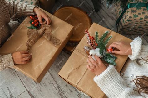 premium photo children   christmas tree unpacking gifts