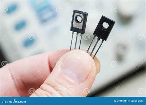 man holding  transistor semiconductor stock image image
