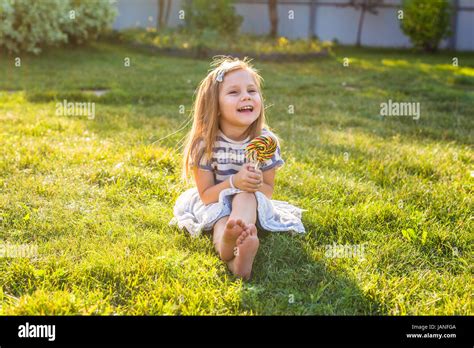 cute cauasian baby girl  big lollipop stock photo alamy