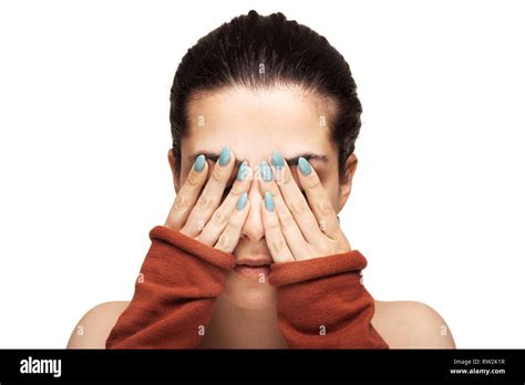 beautiful girl hiding her face with her hands Stock Photo - Alamy