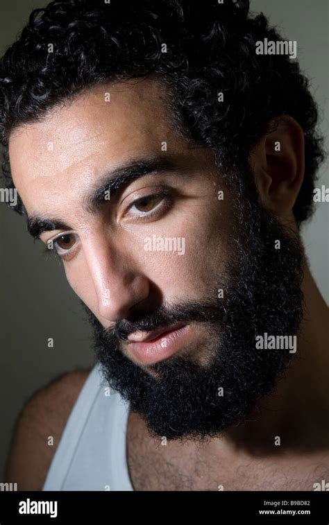 Close up portrait of a young Middle Eastern man with long beard Stock ...