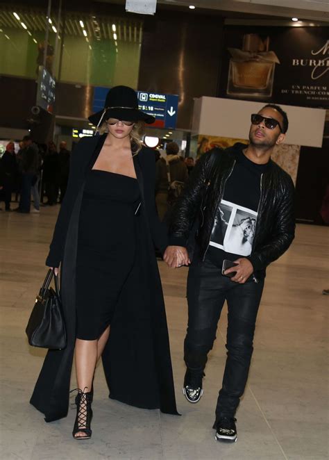 CHRISSY TEIGEN at Charles De Gaulle Airport in Paris 12/27/2015