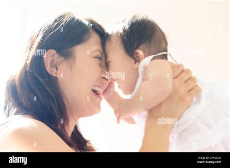 Mother nursing her baby Stock Photo - Alamy