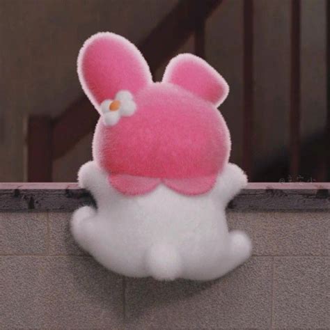 pink  white stuffed animal sitting  top   wall